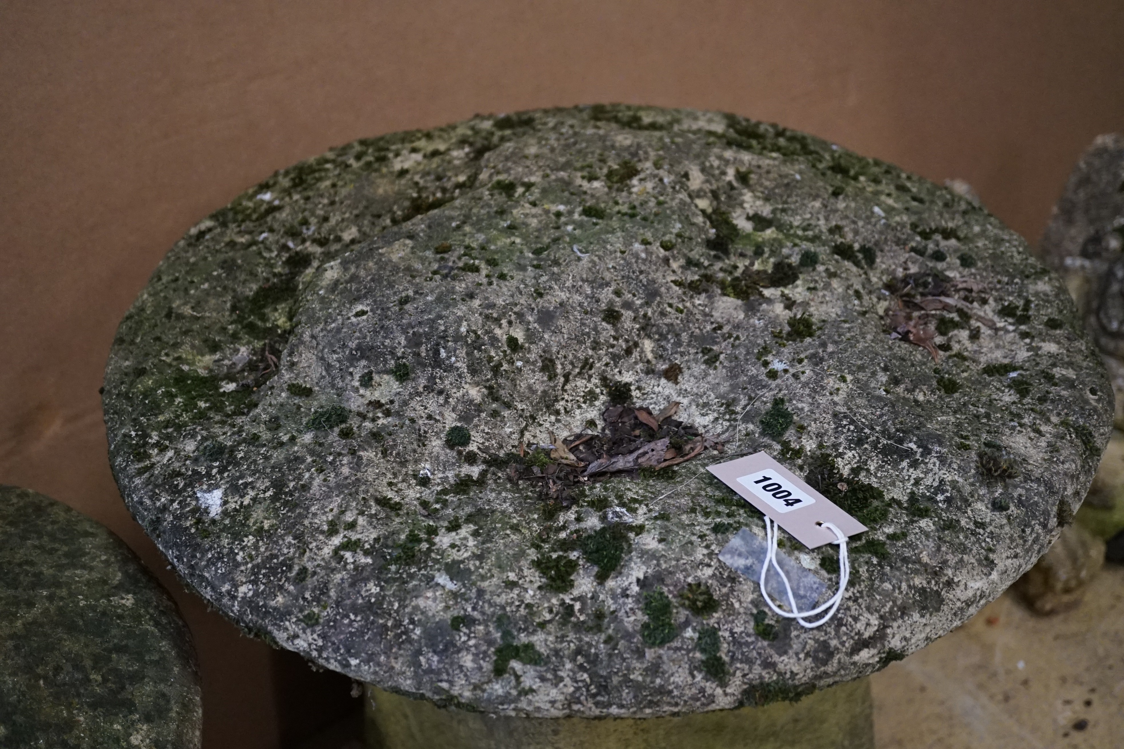 A carved stone staddle stone, height 64cm, diameter 54cm
